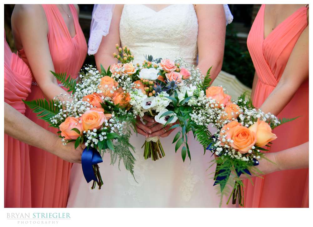 bride and bridesmaids holding flowers